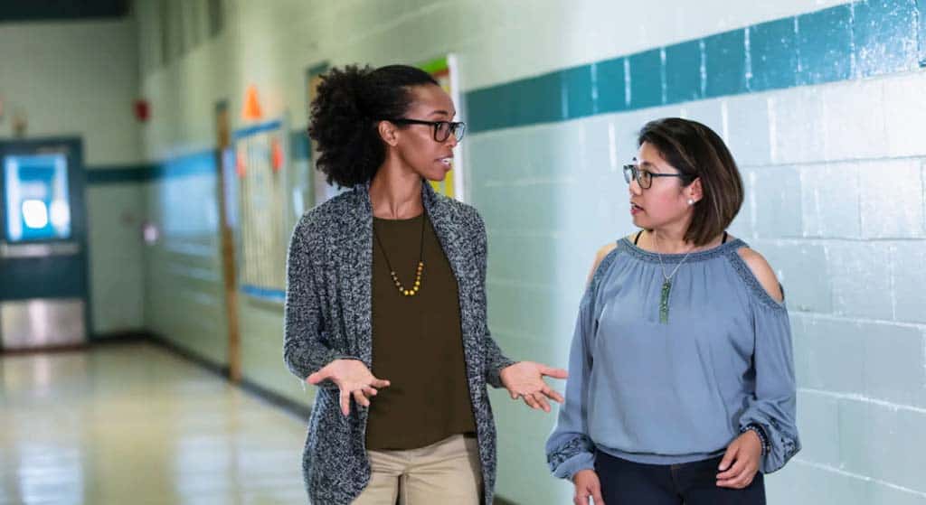 An IEP advocate speaking with a school administrator.