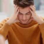 A male high-school student experiencing anxiety due to test-taking at school.