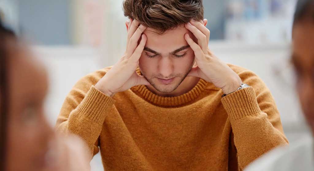 A male high-school student experiencing anxiety due to test-taking at school.